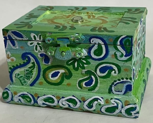 A green hand painted wooden box