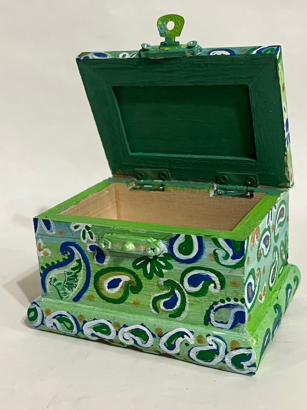 A green hand painted box with lid