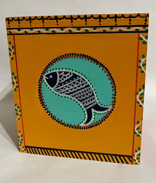 A shaded red and orange fish art tissue box cover