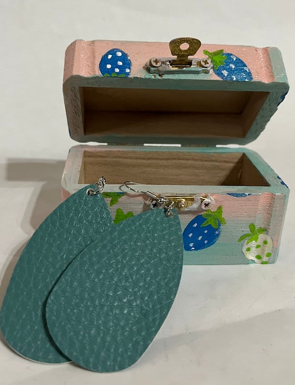 A wooden box with matching earring