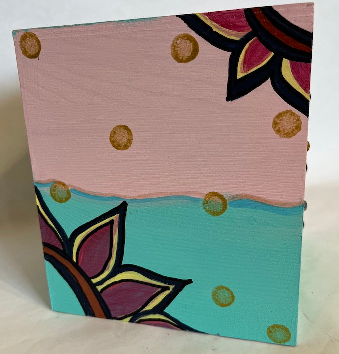 A hand painted wooden tissue box cover shade of pink and blue