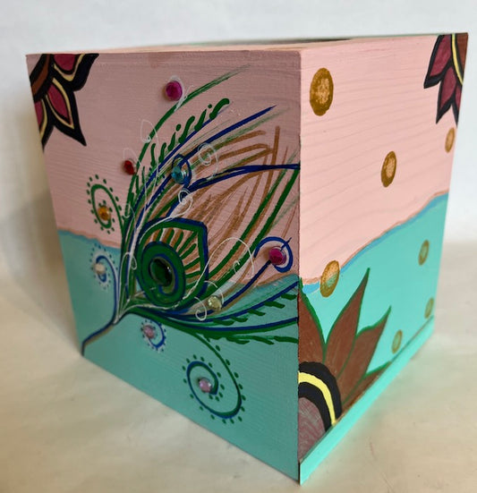 A jeweled peacock tissue box holder
