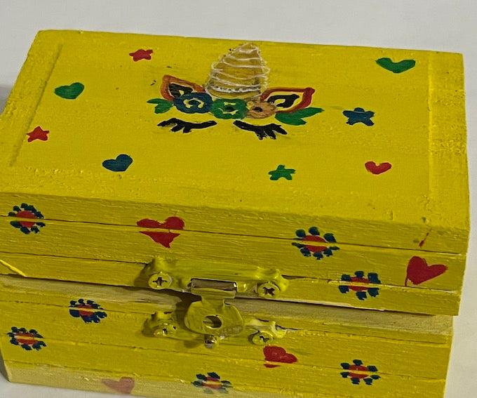 A yellow bright and beautiful hand painted unicorn box