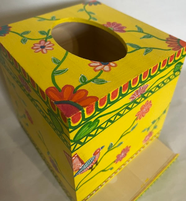 Top of a hand painted bright and colorful tissue box cover