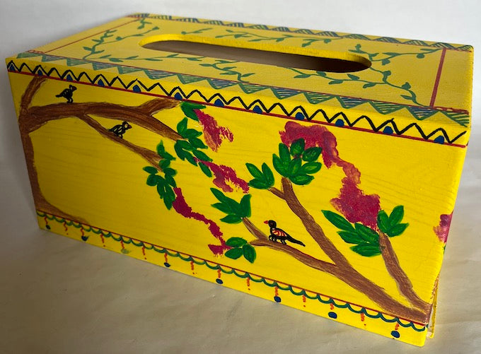 A yellow bright hand painted tissue box cover