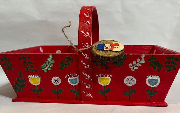 A red hand painted gift basket