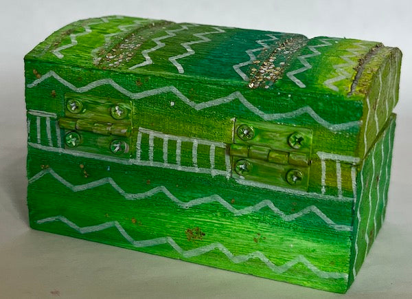 A green hand painted gift box