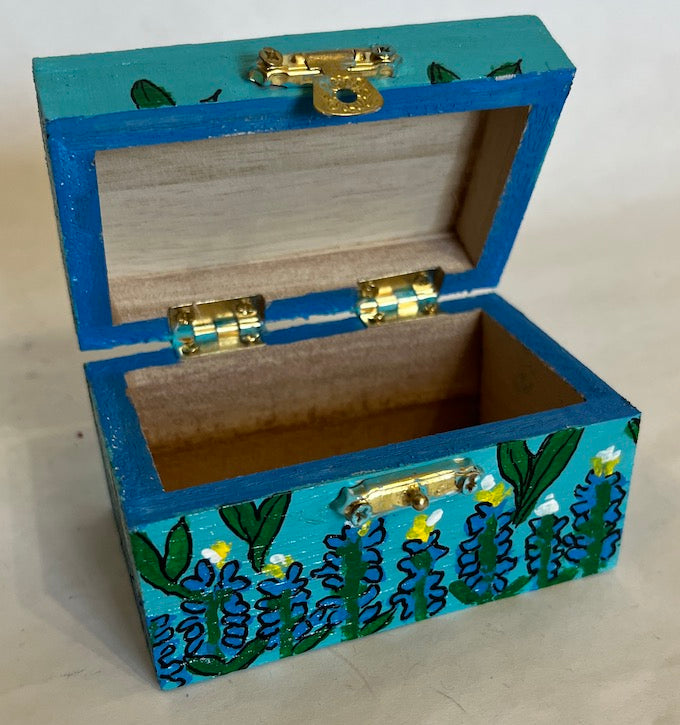 A hand painted wooden blue bonnet themed box