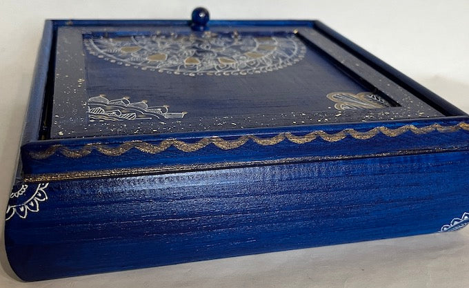 A blue hand painted jewelry box