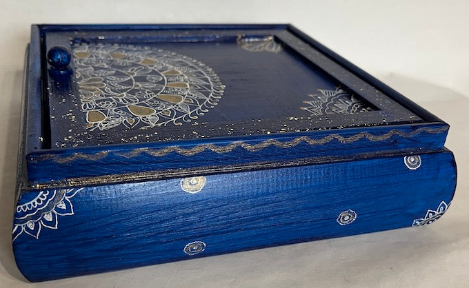A dark blue jewelry box