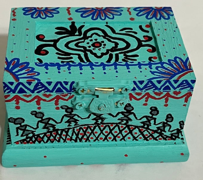 A blue gift box hand painted Warli art