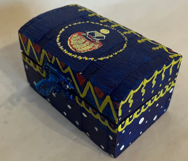 A small blue hand painted wooden box