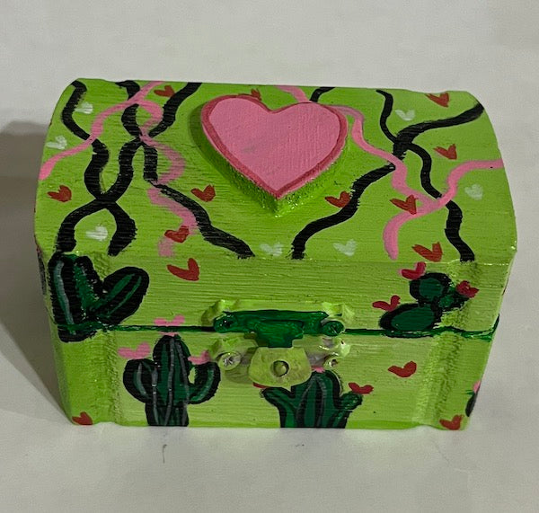 A bright green wooden box with a heart top