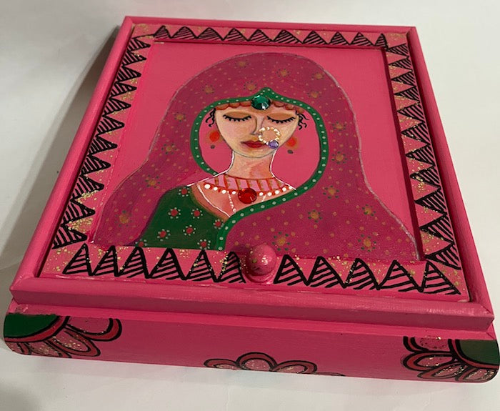 A pink hand painted Indian bride jewelry box