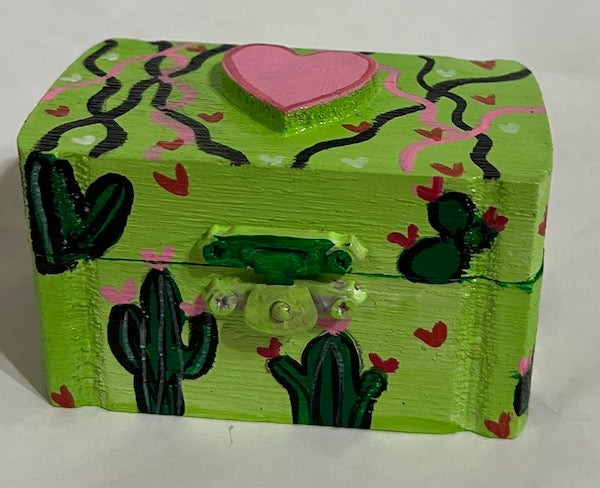 A bright green hand painted small box