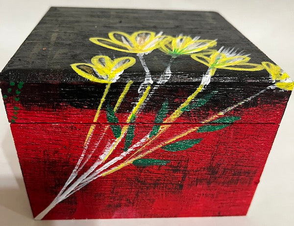 A hand painted square wood box