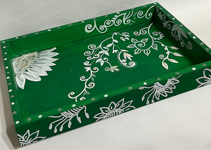 A hand painted green and white floral tray