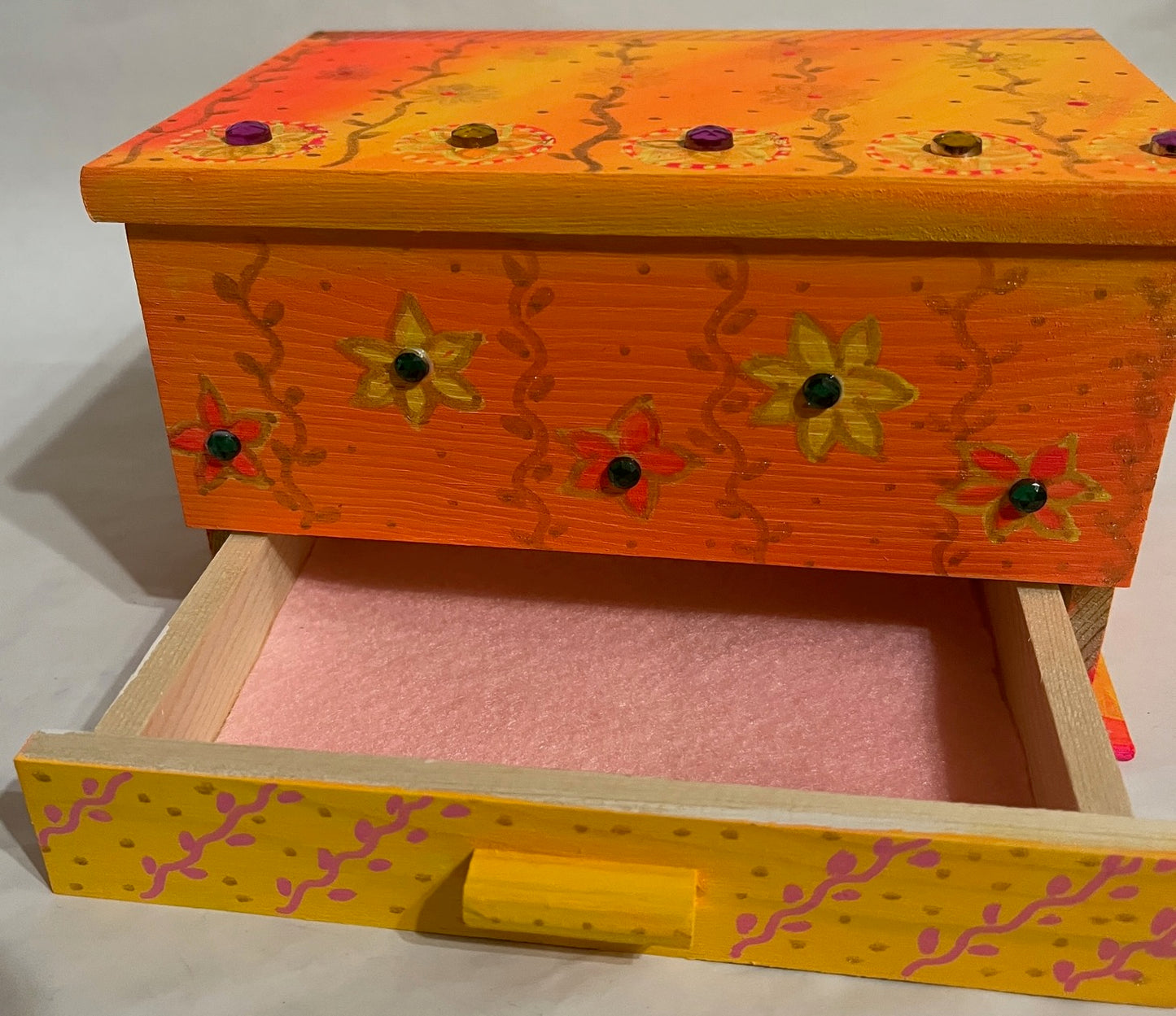 A hand painted wood jewelry box