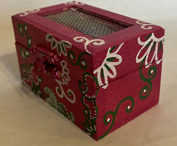 A magenta hand painted floral gift box with net top
