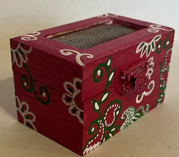 A floral magenta hand painted gift box with net top