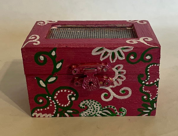 A hand painted floral magenta gift box with net top