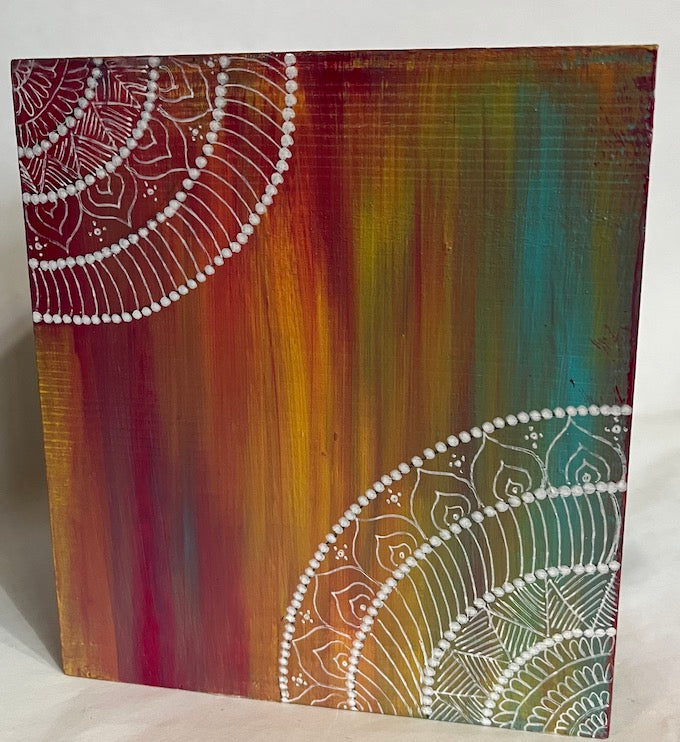 A multicolored mandala art tissue box cover