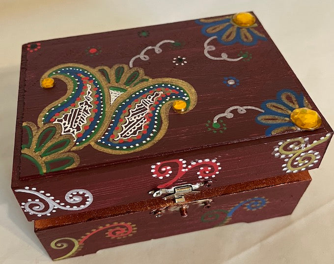 A hand painted maroon gift box