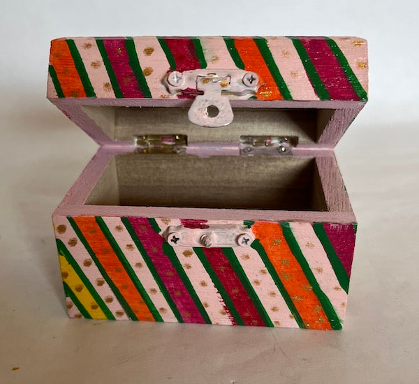A small accessory box hand painted, colorful with stripes