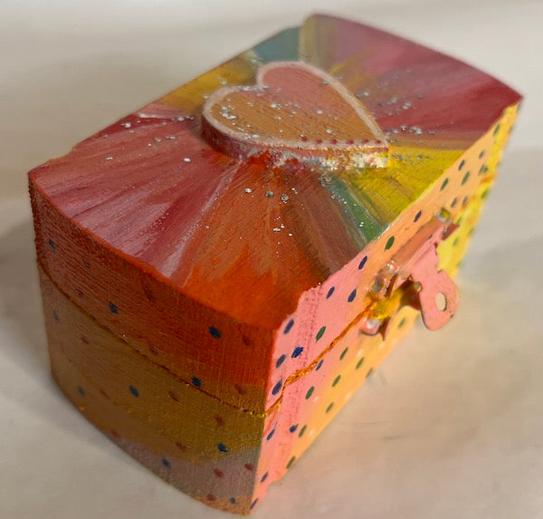 A colorful wooden heart top box
