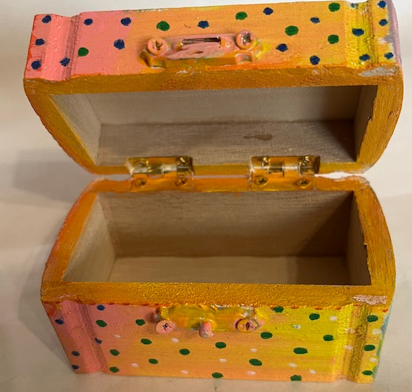 A small hand painted wooden box with lid
