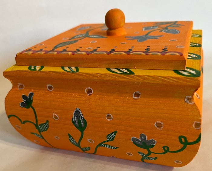 A pretty orange hand painted floral orange box