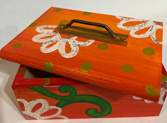 An orange box with removable lid