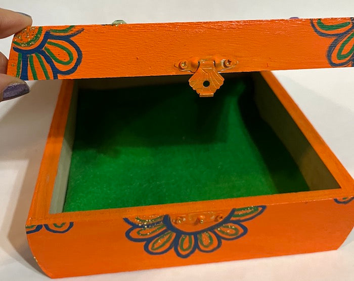 A hand painted peacock wooden keepsake box