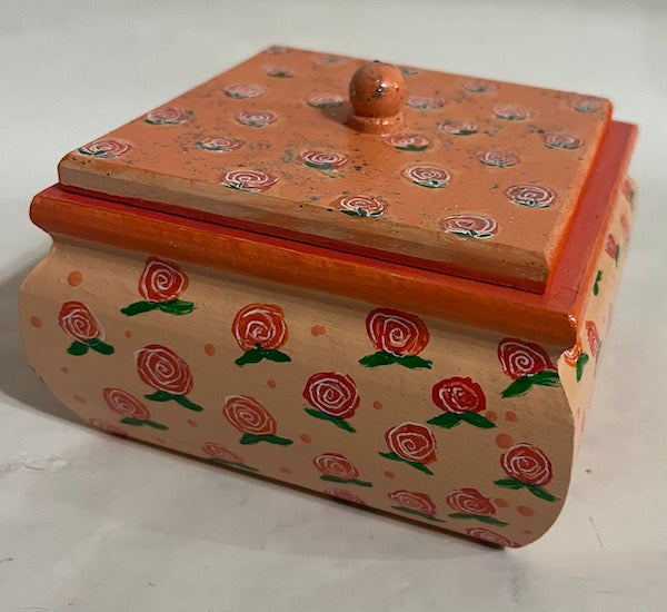 An orange rose box with lid