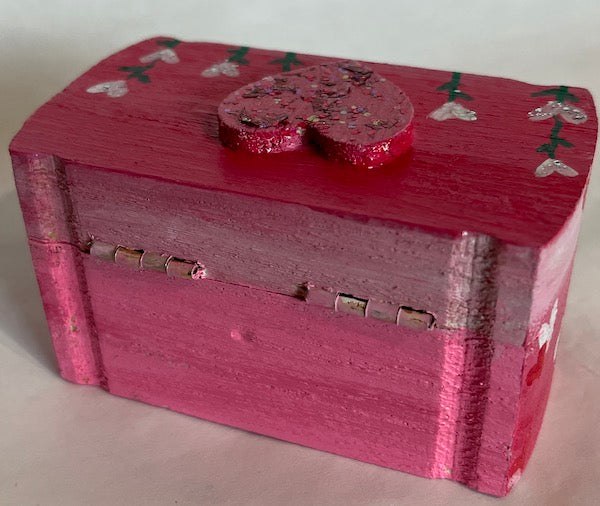 A pink small wooden box 
