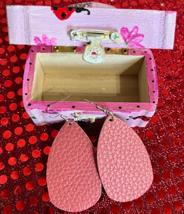 A matching pink leather earring to go with this box.