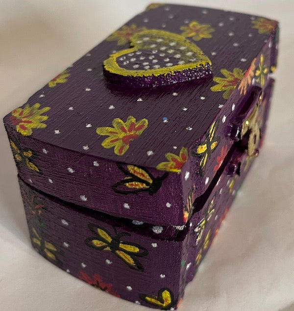 A purple box with yellow designs