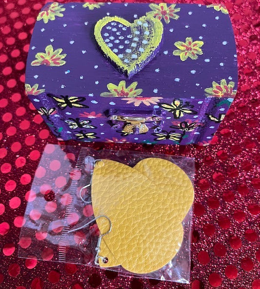 A bright hand painted box with leather earrings