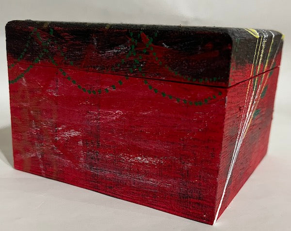 A red, black and white hand painted box