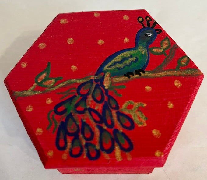 A beautiful hand painted red hexagon box
