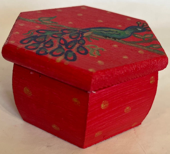 A small hexagon hand painted box