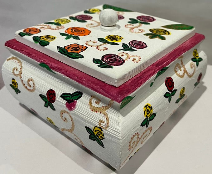 A lovely hand painted  rose themed wooden box with a glitter lid.