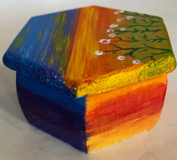 A hand painted sunset themed hexagon shape wooden gift box