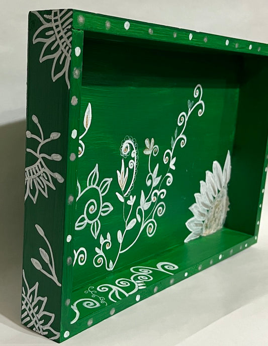 A bright green and white hand painted tray