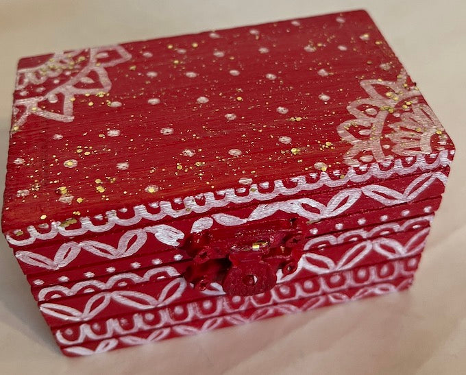 A small hand painted red festive accessory gift box 